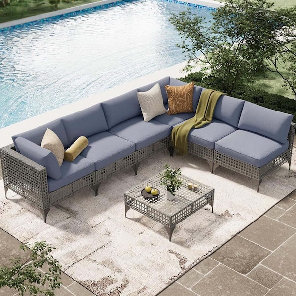 Zeus & Ruta 7-Piece Gray Wicker Outdoor Conversation Set with Gray Blue Cushions and 1-Coffee Table