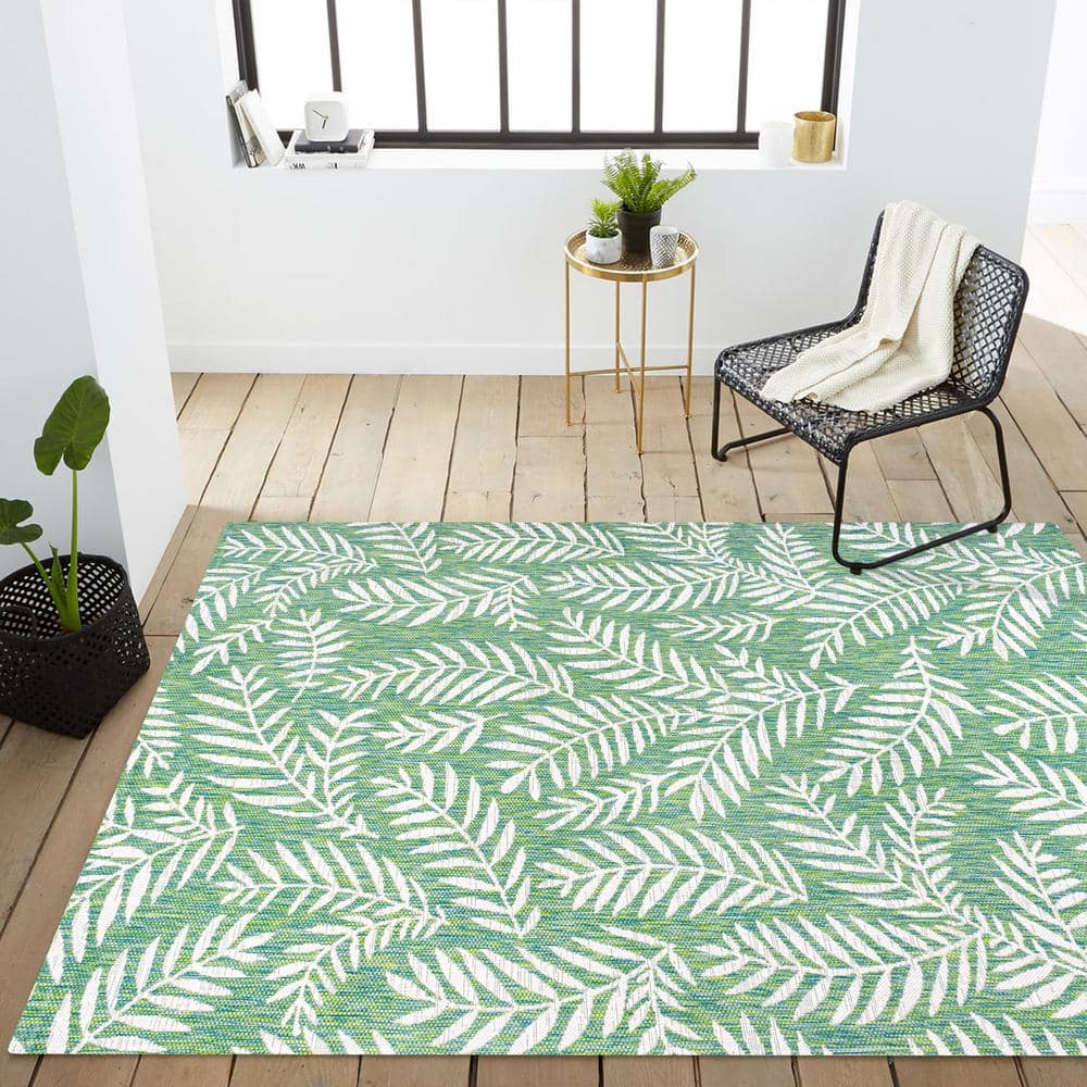 4' x 6' Green and Cream Synthetic Palm Frond Area Rug