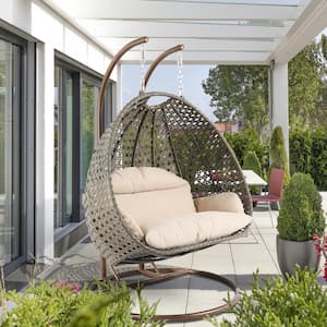 2-Person Bronze Wicker Patio Swing with Beige Cushion