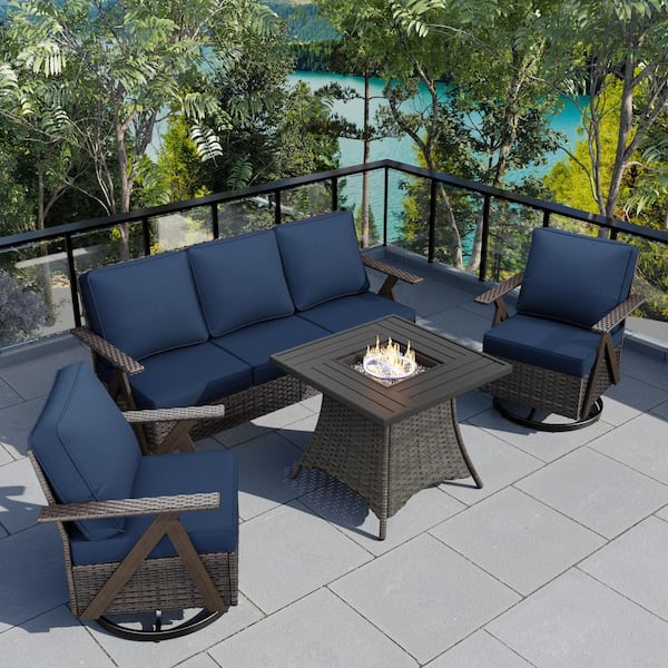 4-Piece Wicker Patio Conversation Set 50000 BTU Fire Pit Table with Blue Cushions and Swivel Rocking Chairs