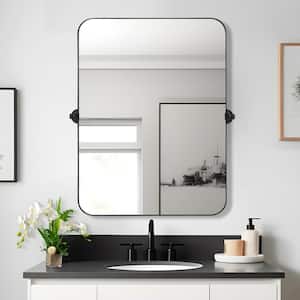 24 in. W x 32 in. H Rectangular Metal Framed Pivoted Bathroom Wall Vanity Mirror in Black