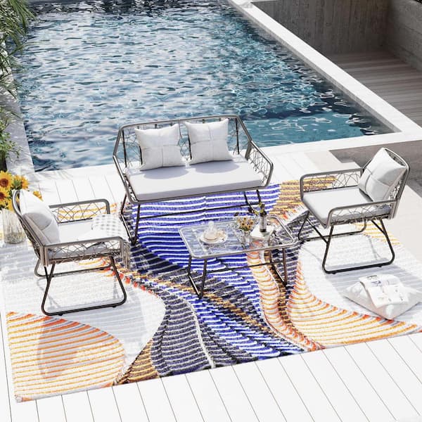 Zeus & Ruta 4-Piece Patio Furniture Wicker Outdoor Conversation Set with Soft Grey Cushions and 1-Glass Table