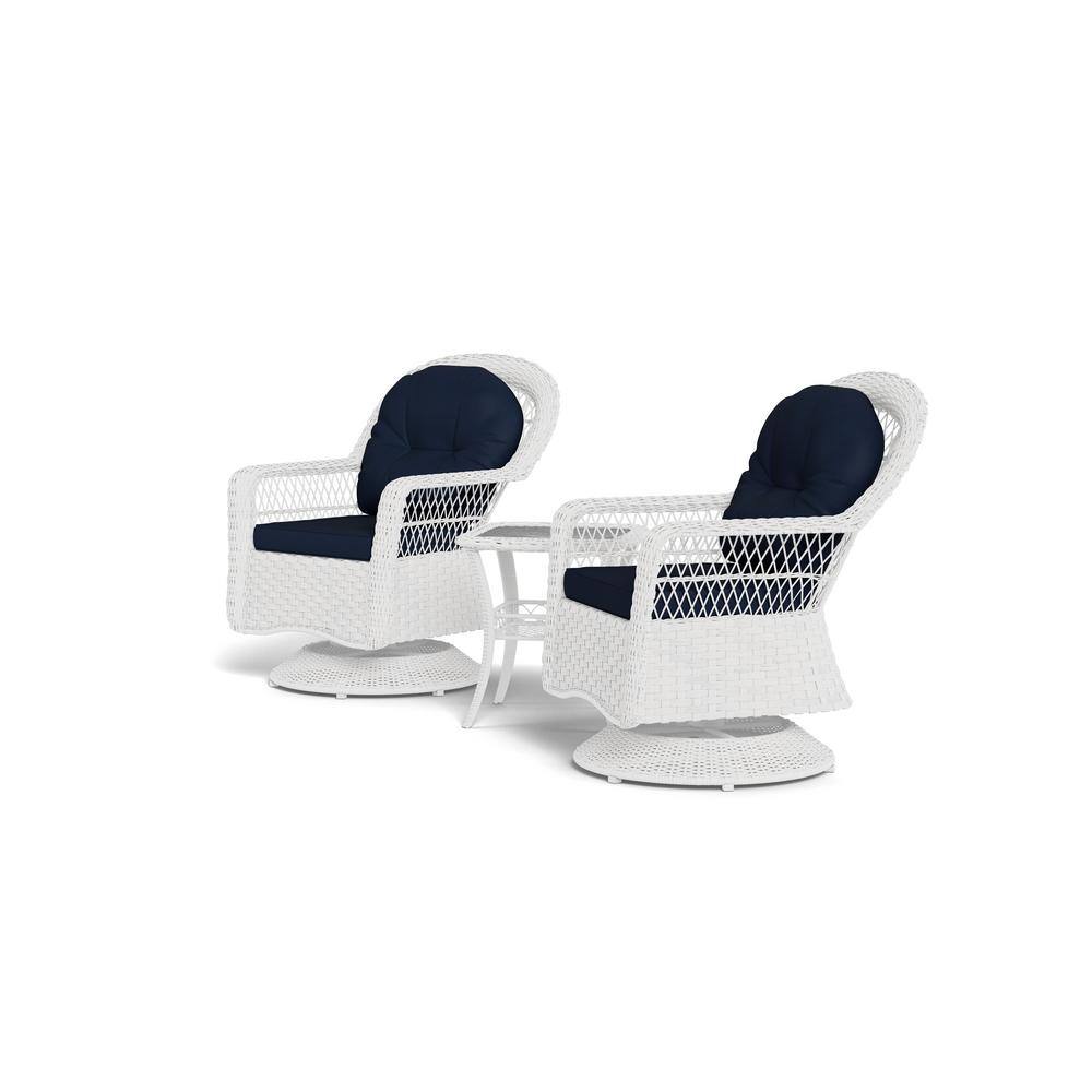 Two white resin wicker chairs with blue cushions and a small table.