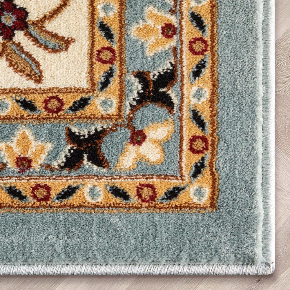 Light Blue and Ivory Synthetic Oriental Area Rug 5'3" x 7'3"