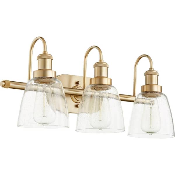 Hollis Transitional, 24 Width in. 3-Lights Aged Brass Finish, Vanity Light, with Clear Glass Shades