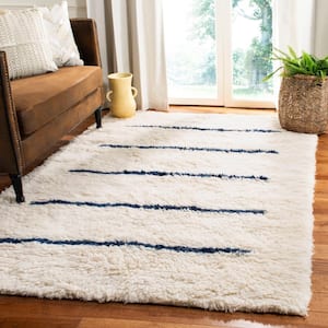 Kenya Ivory/Navy 6 ft. x 9 ft. Solid Area Rug