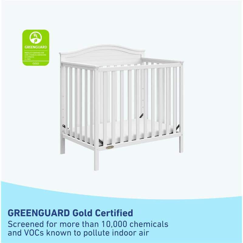 Stella White Pine Wood 4-in-1 Convertible Mini Crib with Foam Mattress