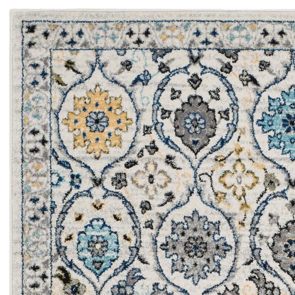 Ivory and Blue Reversible Synthetic Area Rug, 6'7" x 9'