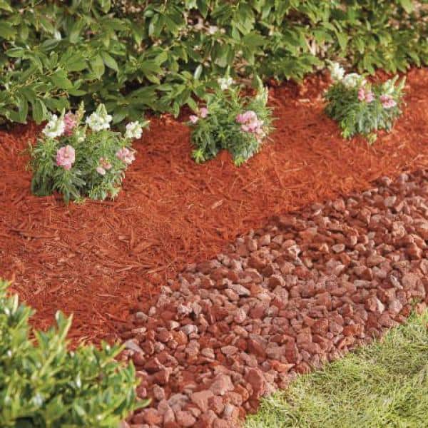 Image of Red gravel mulch in flower bed