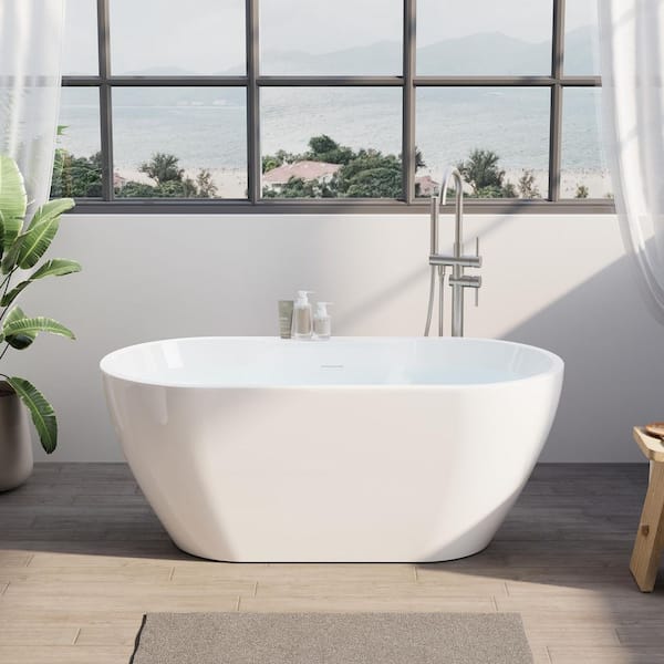 57 in. x 29.5 in. Freestanding Soaking Bathtub with Center Drain in White with Built-In Widened Deck for Storage