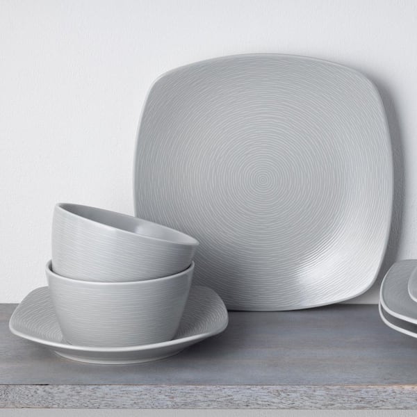 https://images.thdstatic.com/productImages/83d37e10-0586-4a73-b8f2-02a1a81debb1/svn/grey-noritake-dinnerware-sets-4390-12j-44_600.jpg