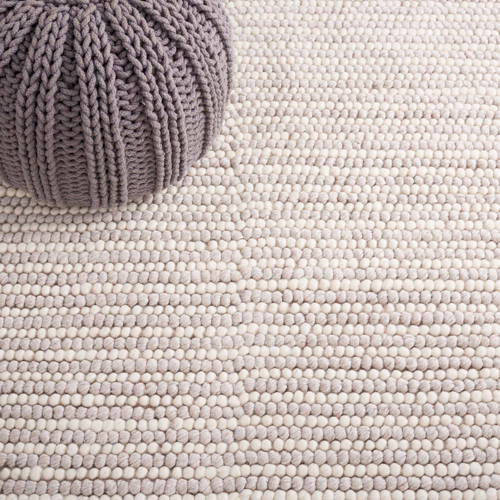 Ivory and Beige 8' x 10' Handwoven Wool and Synthetic Area Rug
