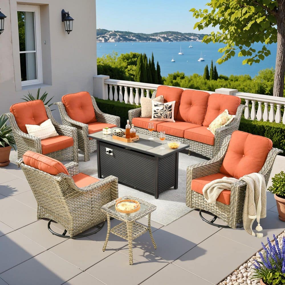 Eureka 7-Piece Wicker Patio Conversation Sofa Swivel Chair Set with Metal Fire Pit Table and Red Cushions