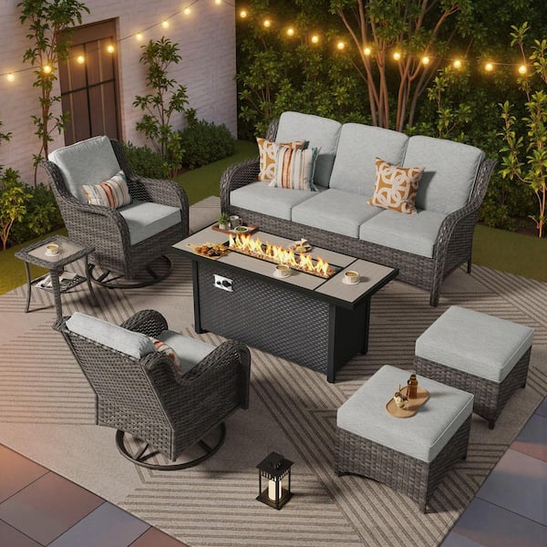 Bali 7 Pieces Wicker Outdoor Patio 54 in. Rectangular Fire Pit Set and Swivel Rocking Chairs with Gray Cushions