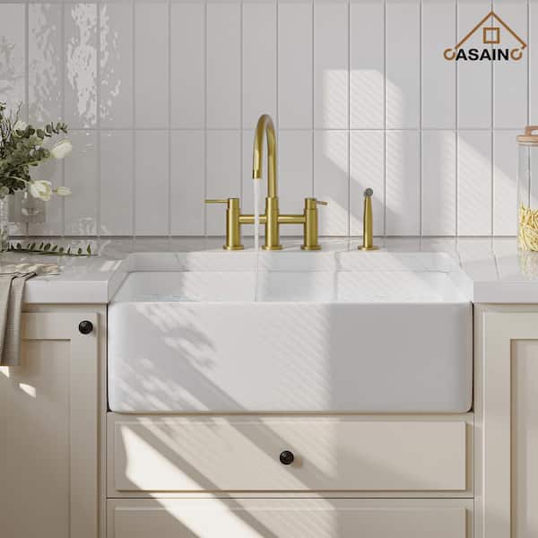 Double Handle Bridge Kitchen Faucet with Side Sprayer in Brushed Gold