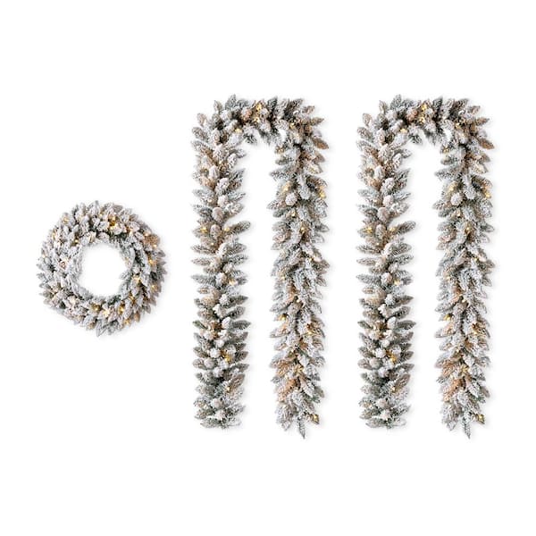 2-Pack 9 ft. Pre-lit LED Artificial Christmas Garland and 24 in. D Pre-lit Snow Flocked Christmas Wreath Set