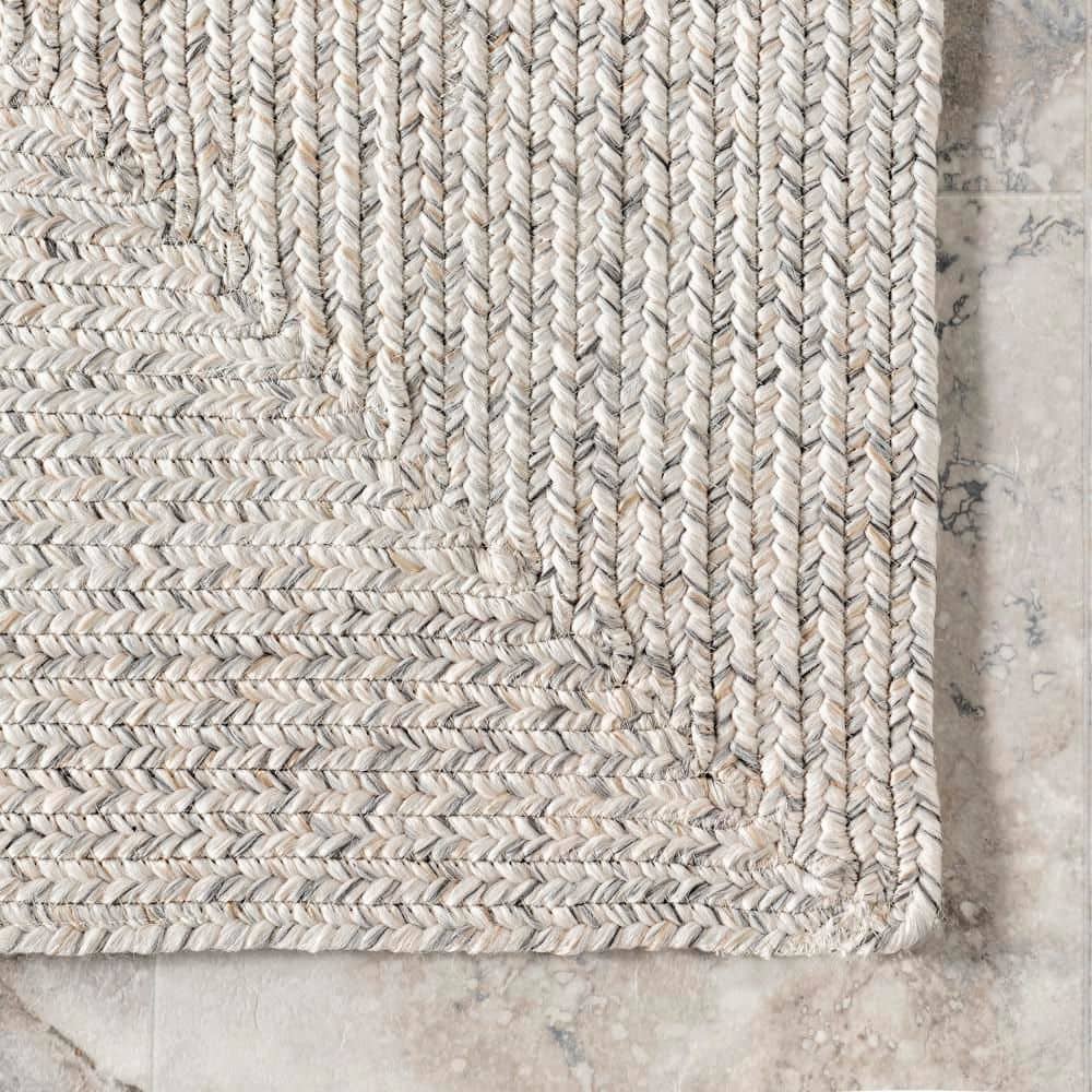 Handmade Ivory Braided 4' x 6' Oval Synthetic Area Rug