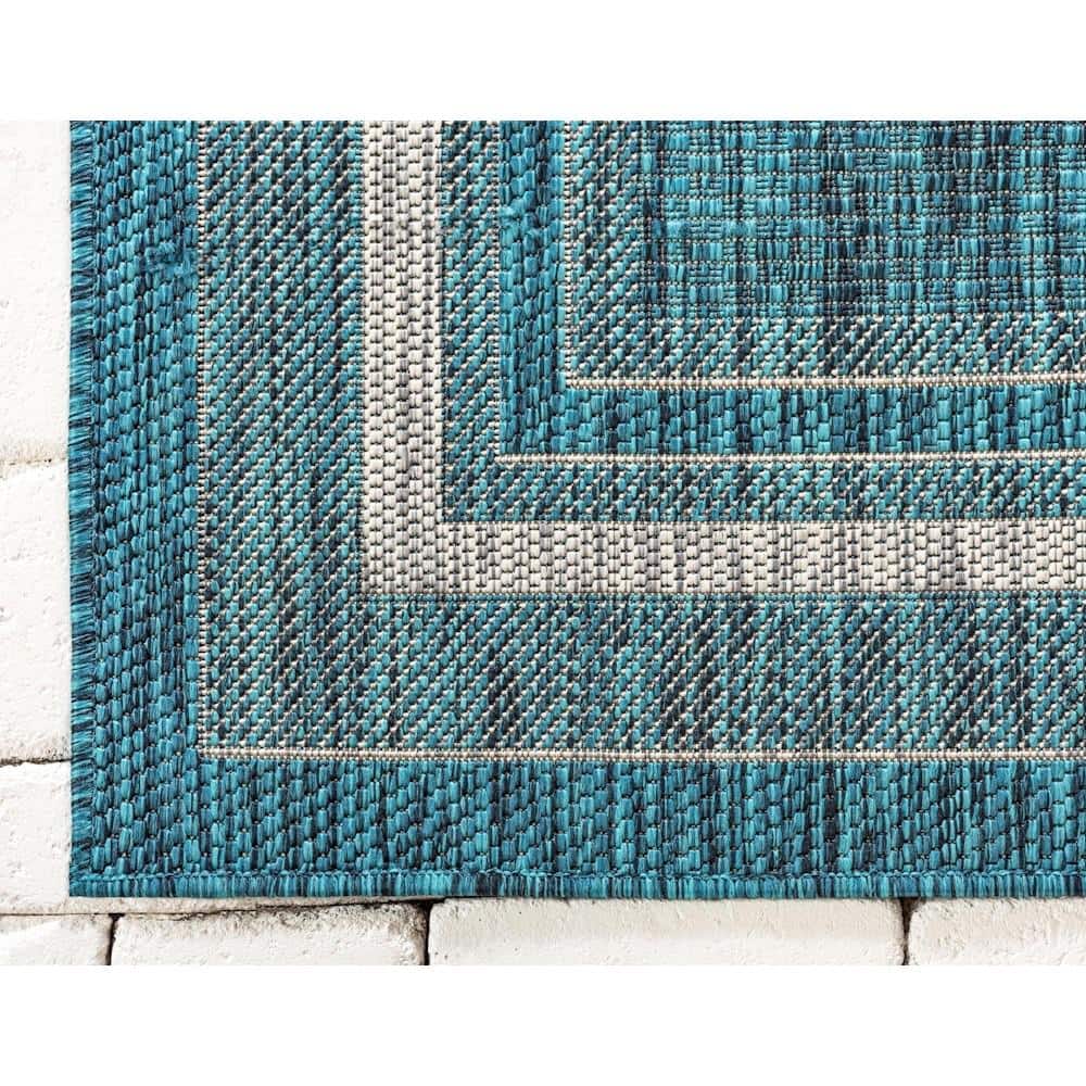 5' x 8' Teal Blue and Beige Flat Woven Outdoor Area Rug