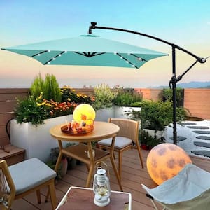 10 ft. Steel Market Solar LED Lighted Tilt Patio Umbrella in Turquoise with Crank and Cross Base