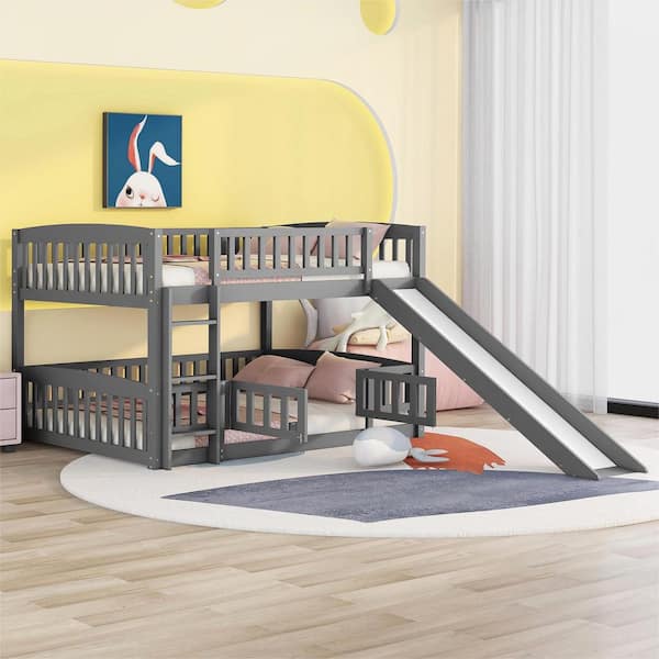 Harper & Bright Designs Gray Full over Full Wooden Low Bunk Bed with Fence, Slide, and Ladder