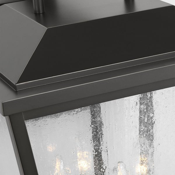 SCOTT LIVING - Kennewick 12.5 in. W x 19 in. H 4-Light Antique Bronze Outdoor Wall Lantern with Distressed Seeded Glass Shade