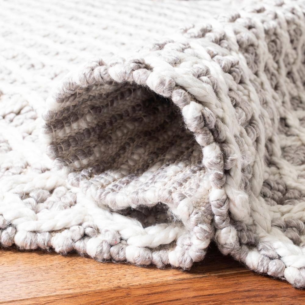 Ivory and Beige Braided Wool Area Rug, 5' x 8'