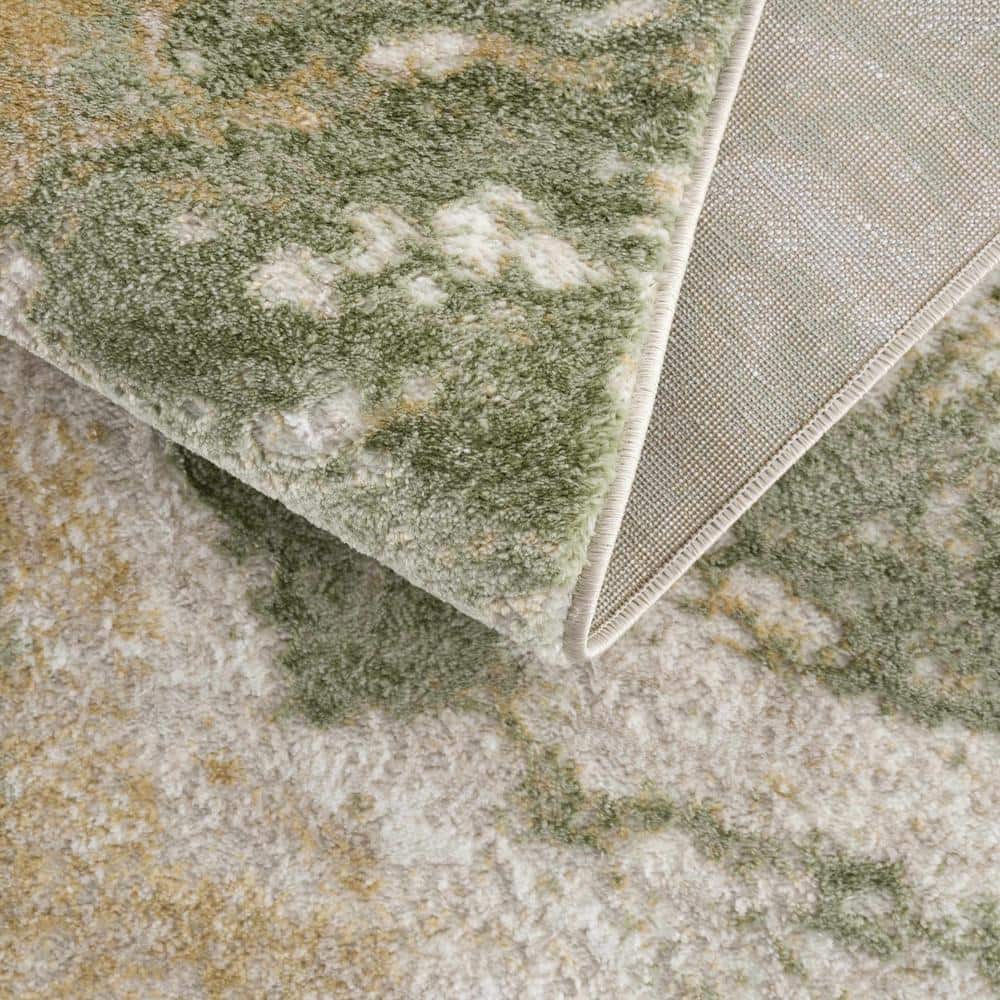 Green and Cream Abstract Polypropylene Area Rug 6'7" x 9'