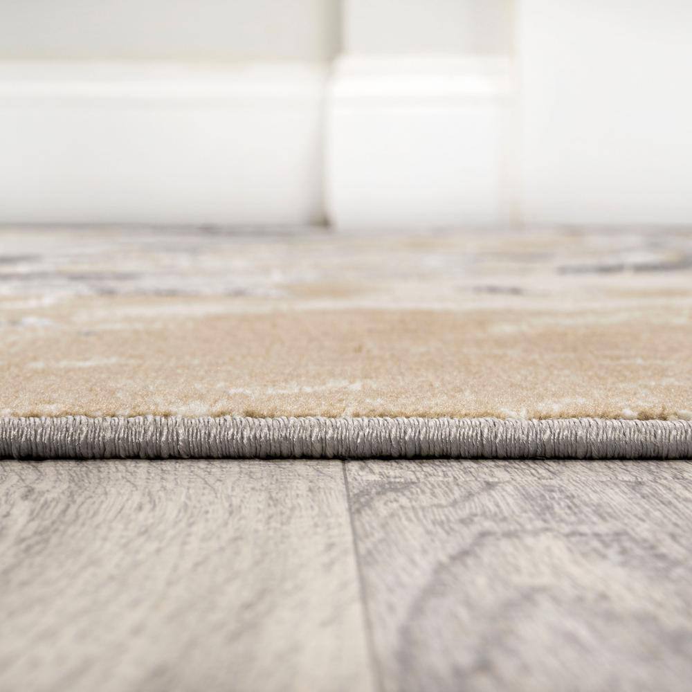 Beige and Ivory Abstract Marbled 8' x 10' Synthetic Area Rug