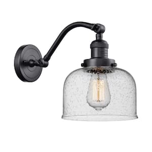 Bell 8 in. 1-Light Matte Black Wall Sconce with Seedy Glass Shade