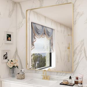 28 in. W x 36 in. H Rectangular Aluminum Alloy Framed and Tempered Glass Wall Bathroom Vanity Mirror in Brushed Gold