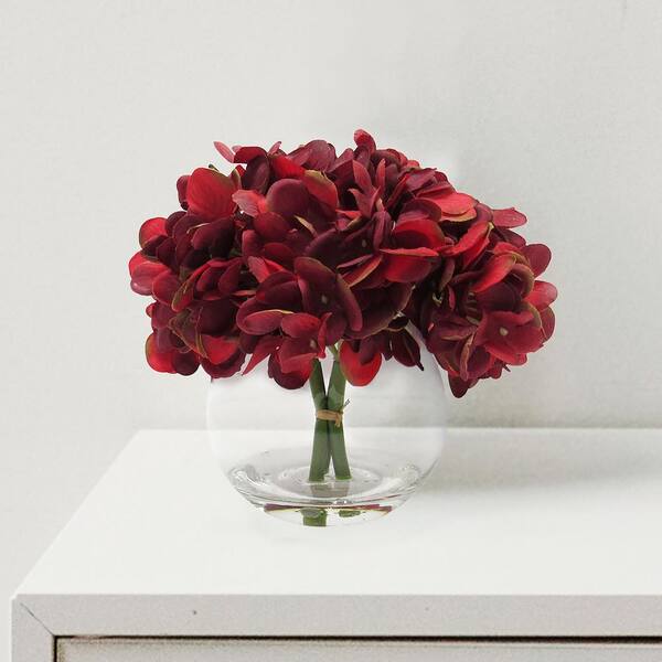 LIVING LUXURY 7 in. Burgundy Artificial Hydrangea Flower Arrangement in Round Glass Vase