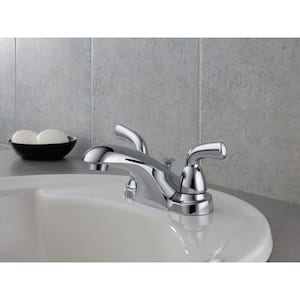 Foundations 4 in. Centerset 2-Handle Low-Arc Bathroom Faucet with Metal Drain Assembly in Chrome