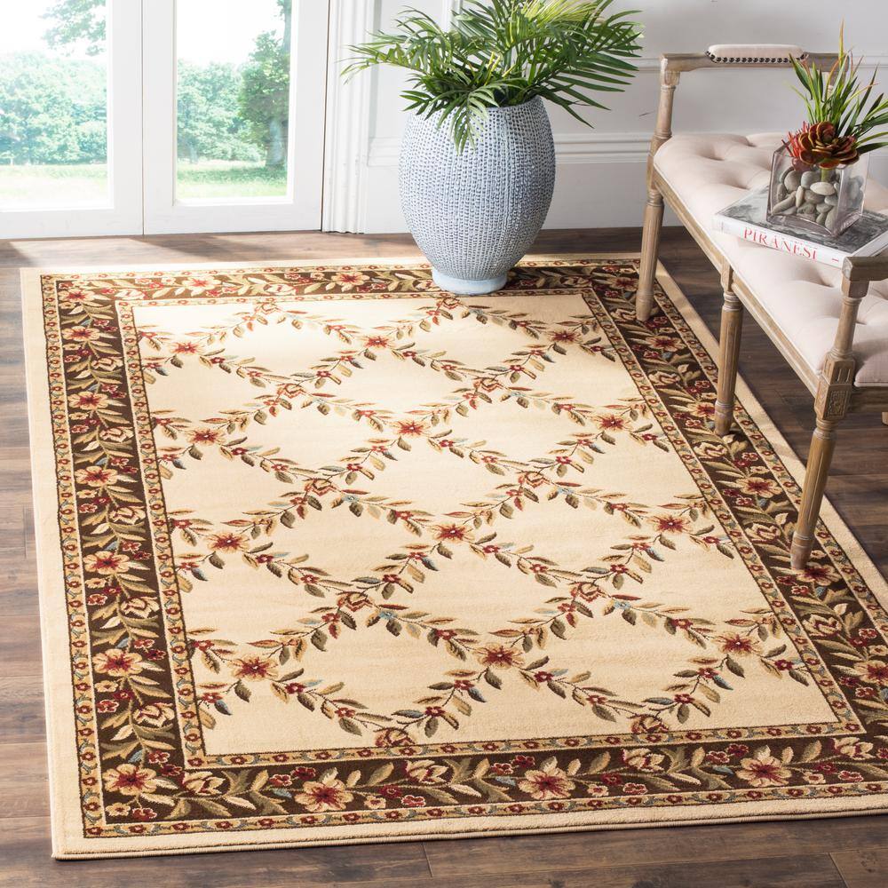 Ivory and Brown Floral Border Medium Pile Area Rug