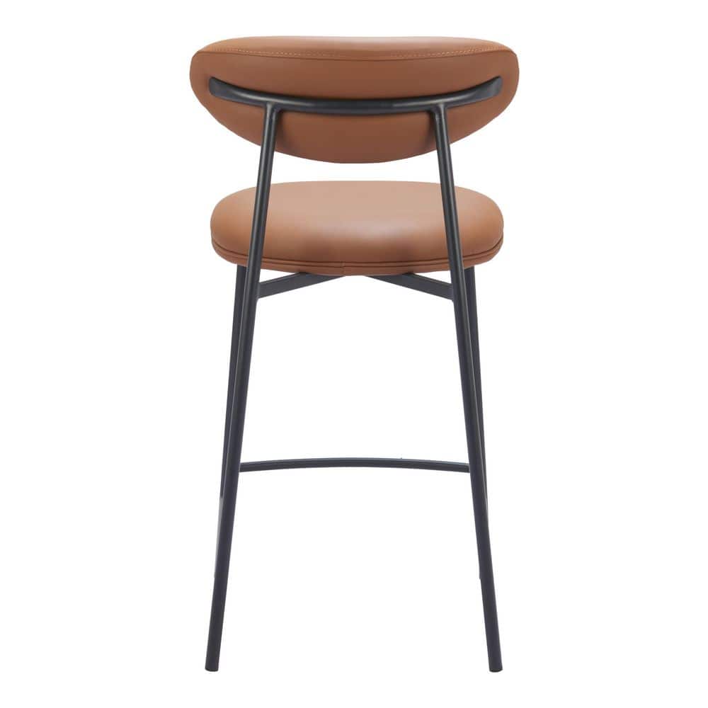 Single brown faux leather bar stool viewed from the side.