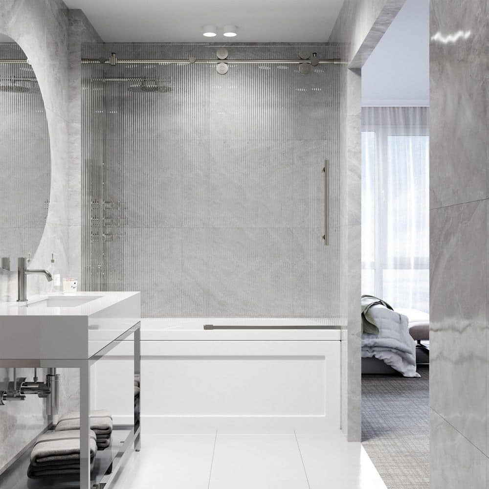 Elan Frameless Sliding Tub Door in Stainless Steel with Fluted Glass