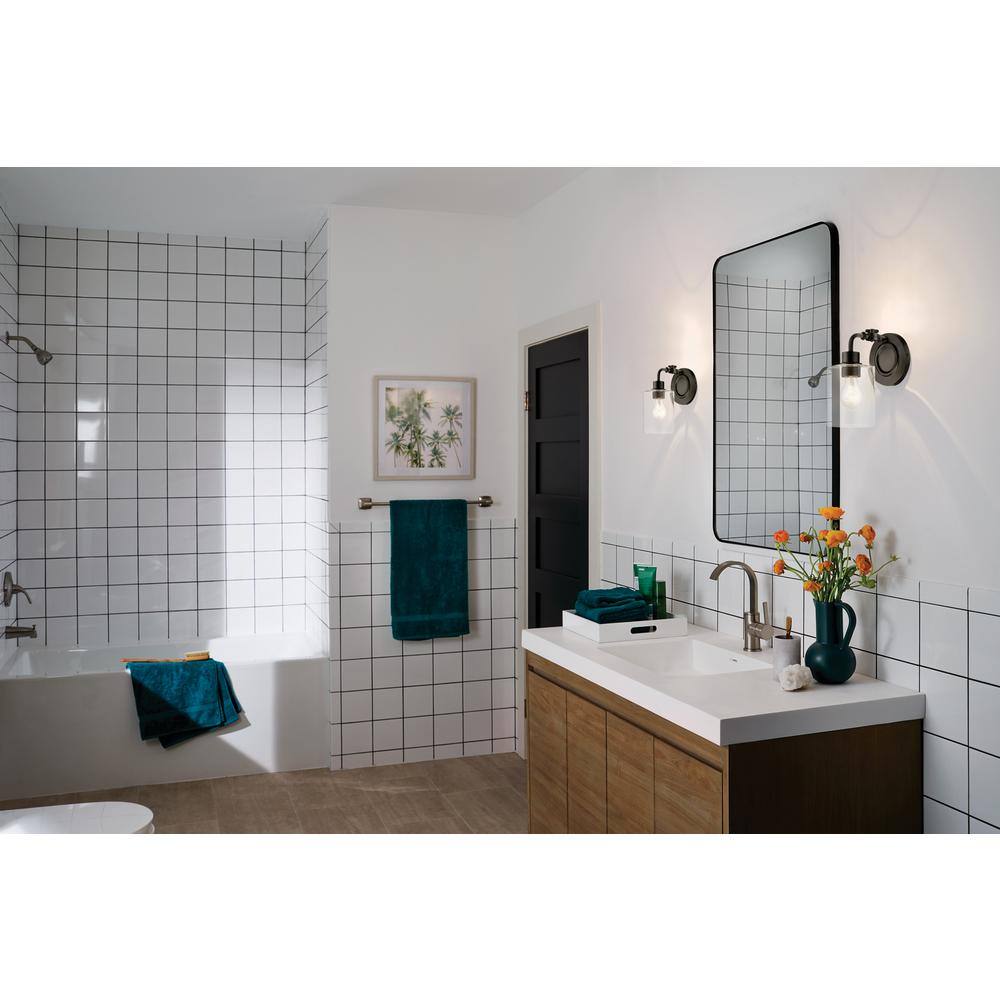 Black Steel Cylinder Wall Sconce with Clear Seeded Glass Shade