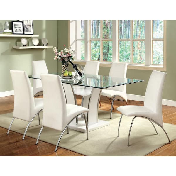 glass dining table and white chairs