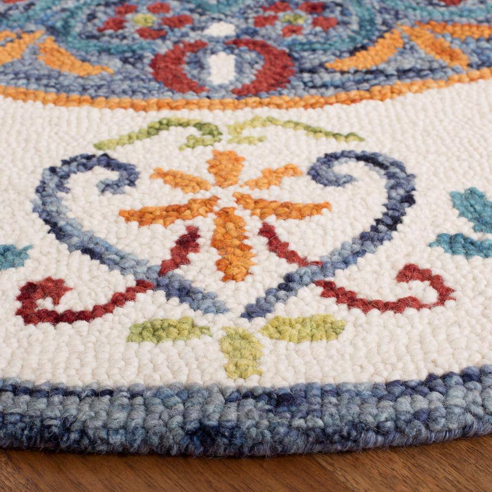 Handmade Blue and Ivory Floral Tufted Wool Round Rug