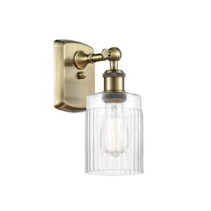 Hadley 1-Light Antique Brass Wall Sconce with Clear Glass Shade