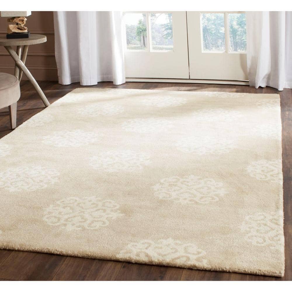 Beige and Ivory 6' x 9' Hand-Tufted Wool and Viscose Area Rug