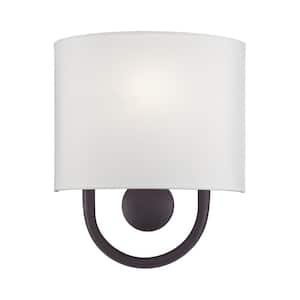 Stratton 9 in. 1-Light Bronze ADA Wall Sconce with Off-White Fabric Shade