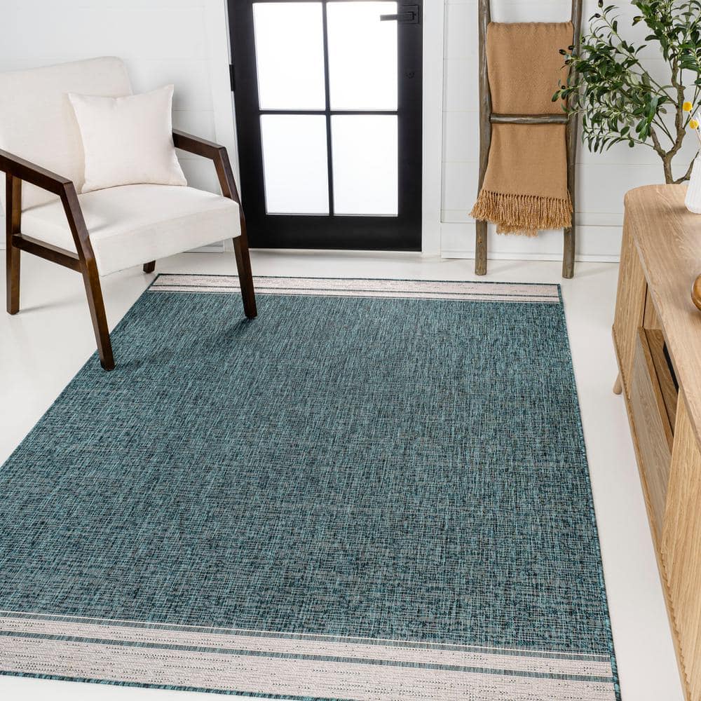 Turquoise and Cream 4' x 6' Solid Synthetic Area Rug