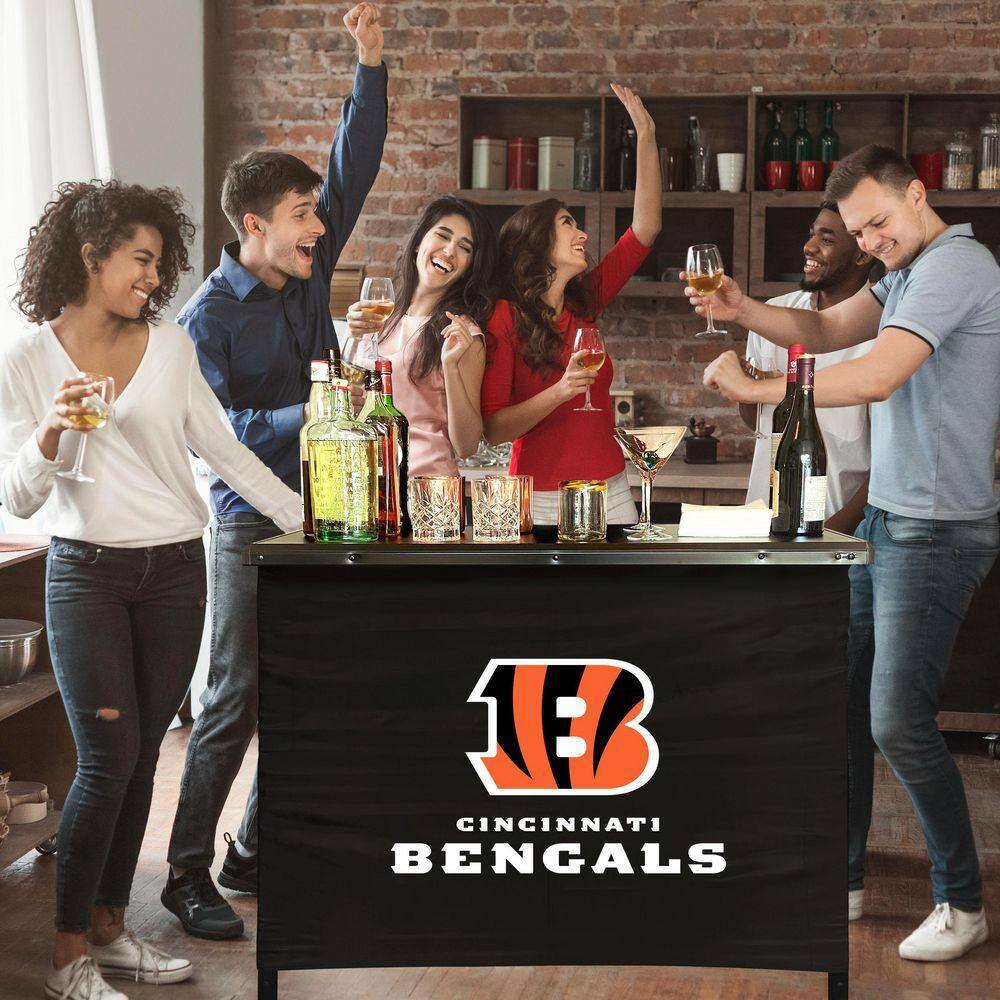 Friends gathering around a portable bar display.