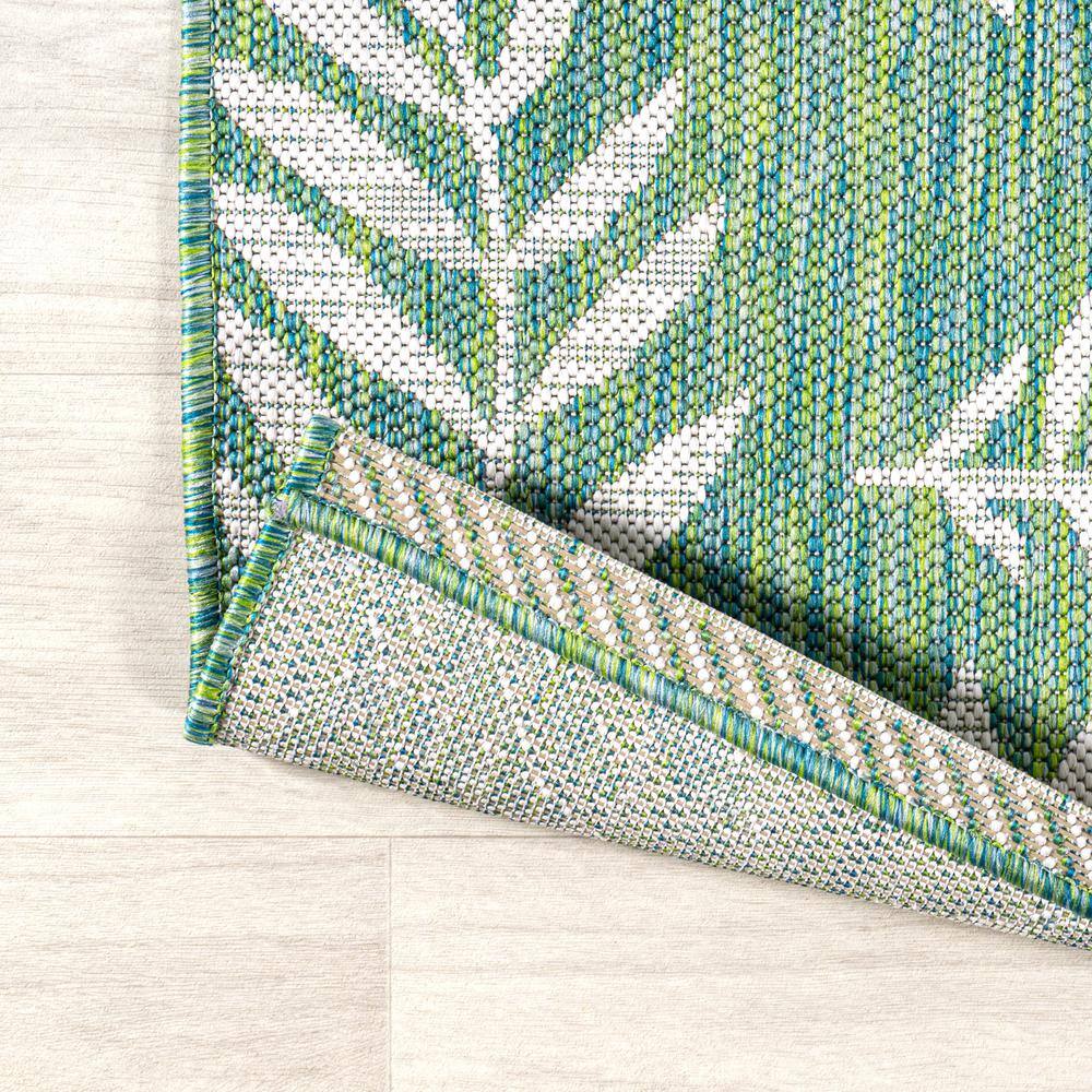 4' x 6' Green and Cream Synthetic Palm Frond Area Rug