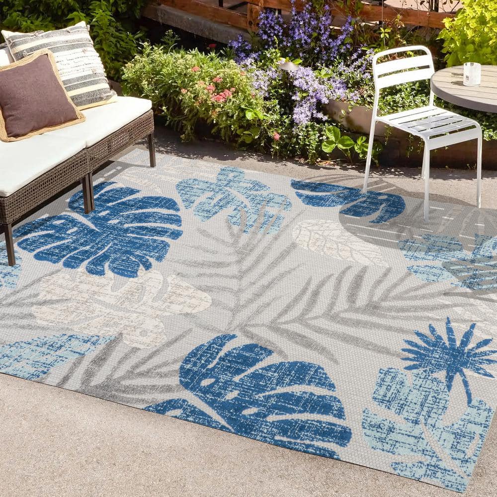 https://images.thdstatic.com/productImages/879c40f1-8907-4771-a992-cae1f384c830/svn/light-gray-navy-jonathan-y-outdoor-rugs-amc113a-8-64_1000.jpg