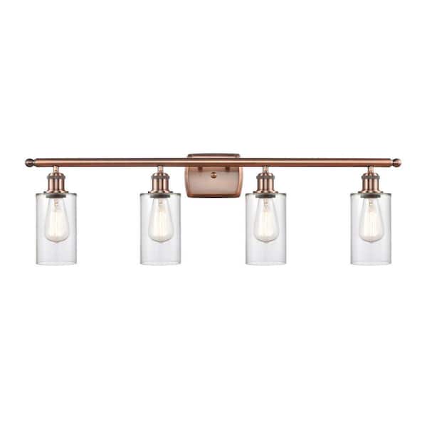 Clymer 36 in. 4-Light Antique Copper Vanity Light with Glass Shade