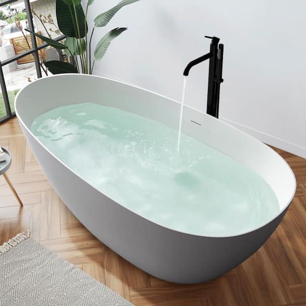 WELLFOR 66.9 in. x 33.46 in. Solid Surface Flatbottom Soaking Bathtub with Center Drain in White