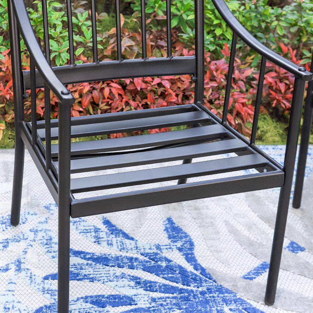 Metal outdoor dining chair placed in a garden setting.