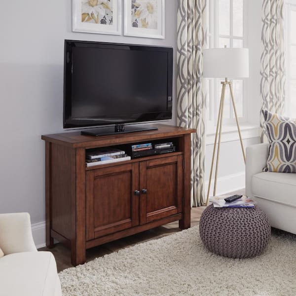 HOMESTYLES Tahoe 44 in. Aged Maple Wood TV Stand Fits TVs Up to 50 in. with Storage Doors