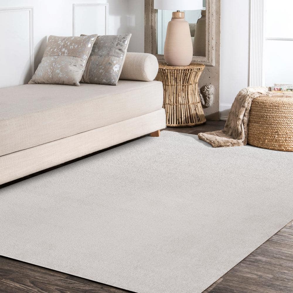Ivory Solid Synthetic Low-Pile Rectangular Area Rug, 4' x 6'